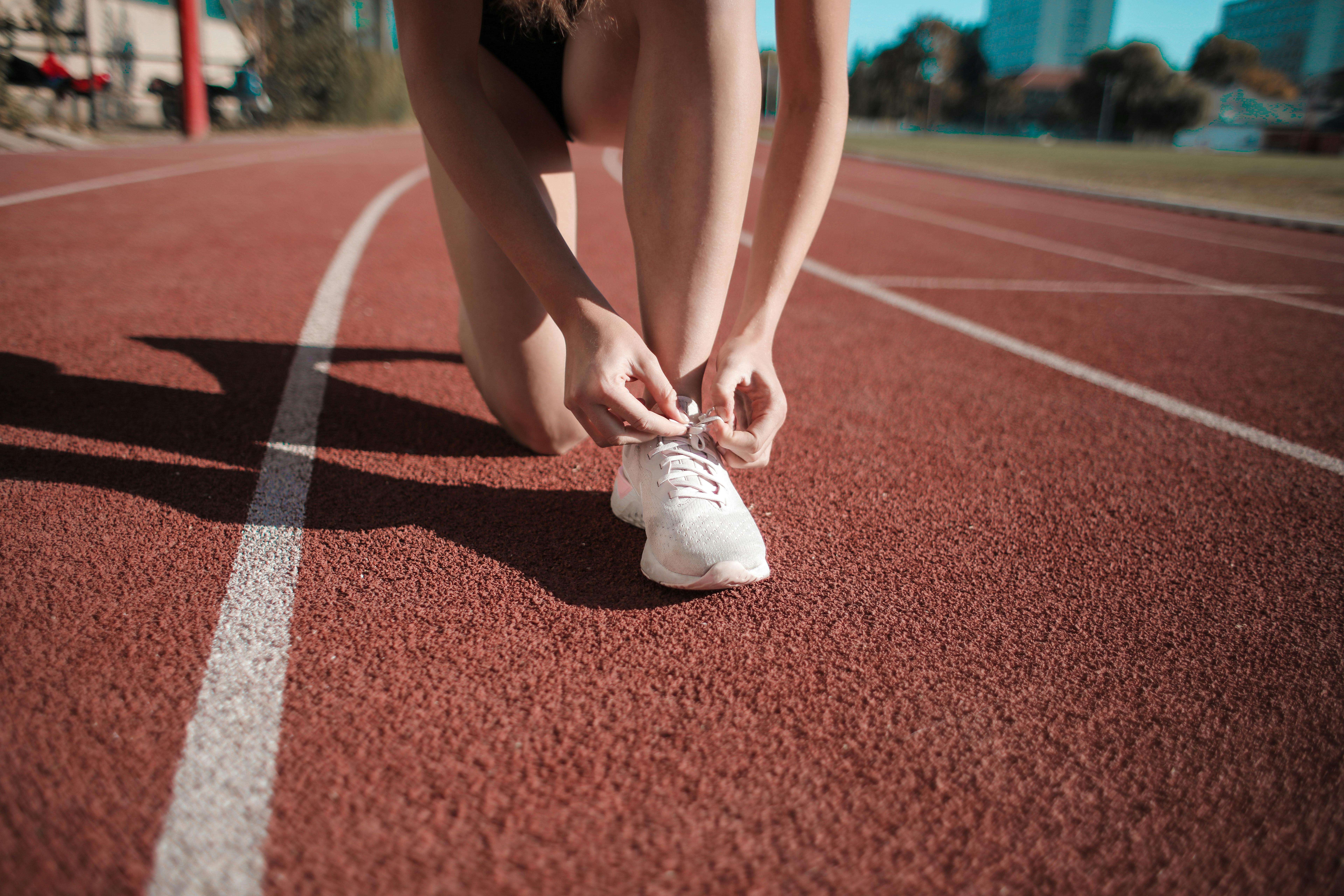Person in white sneakers | Source: Pexels