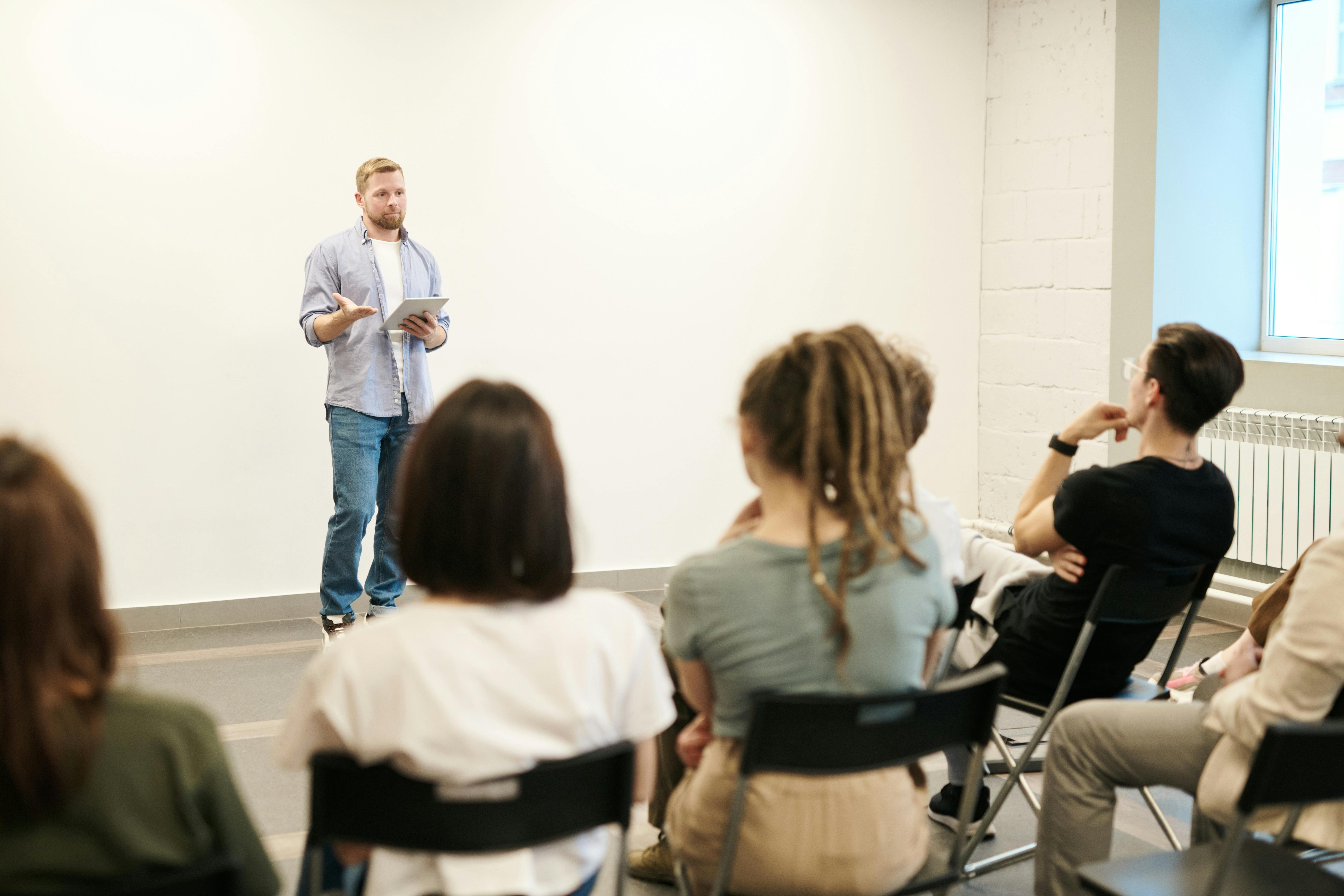 Man speaking to an audience | Source: Pexels