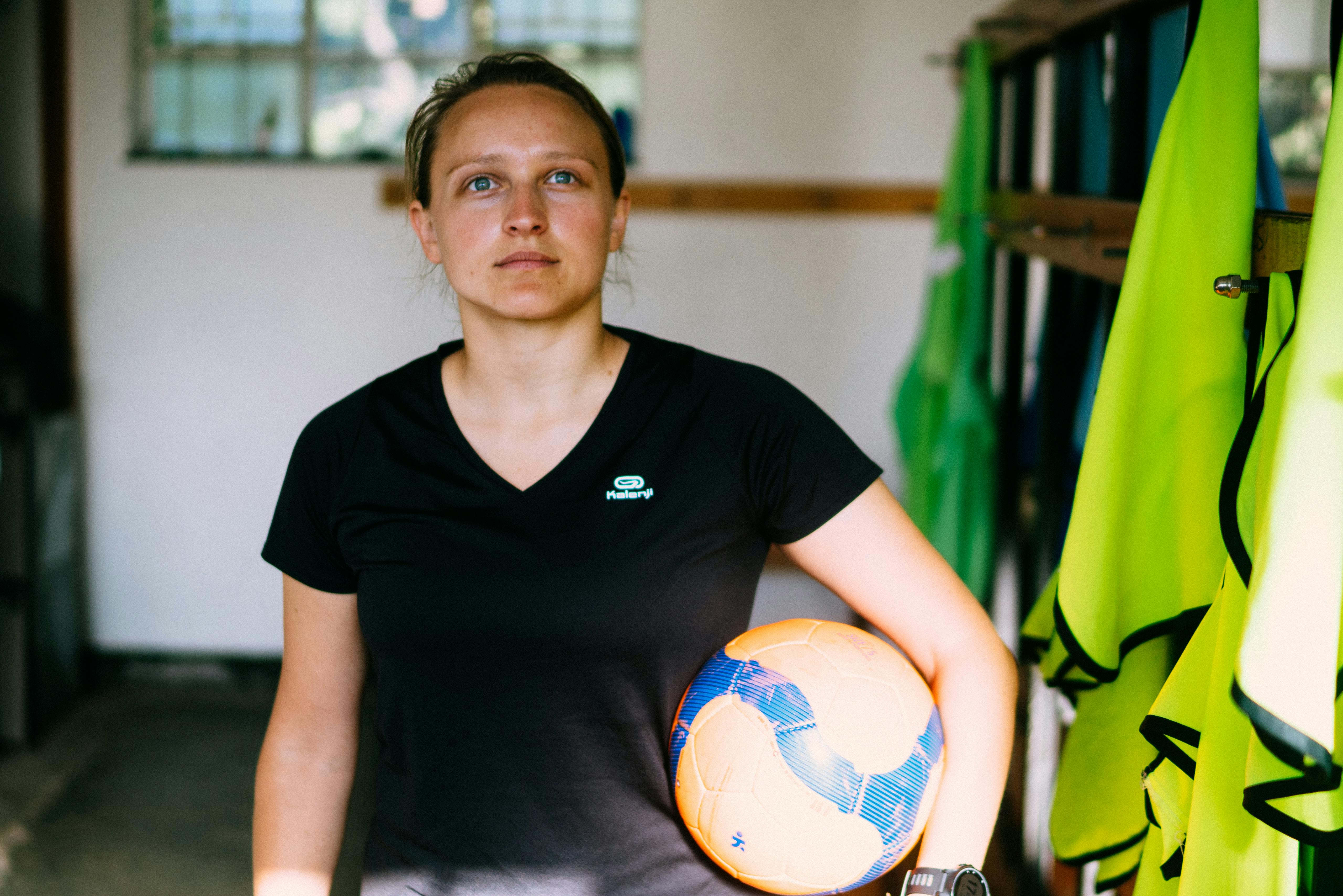Woman with a colorful ball | Source: Pexels