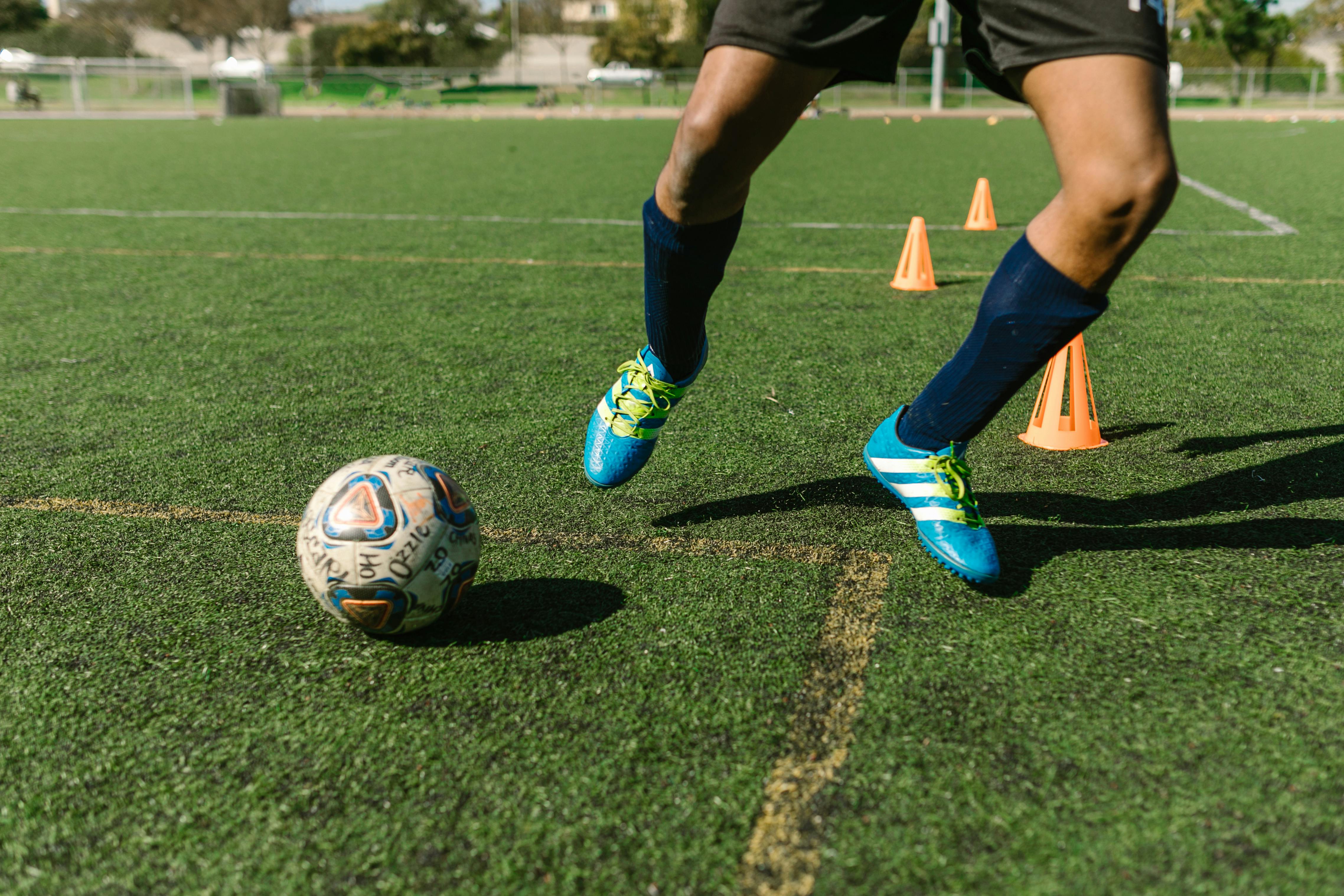 Ball on a football field | Source: Pexels